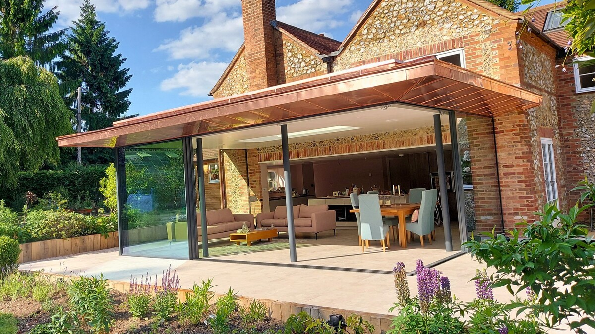 From structural framework to a finished copper-roof extension, opening the home to garden and natural light